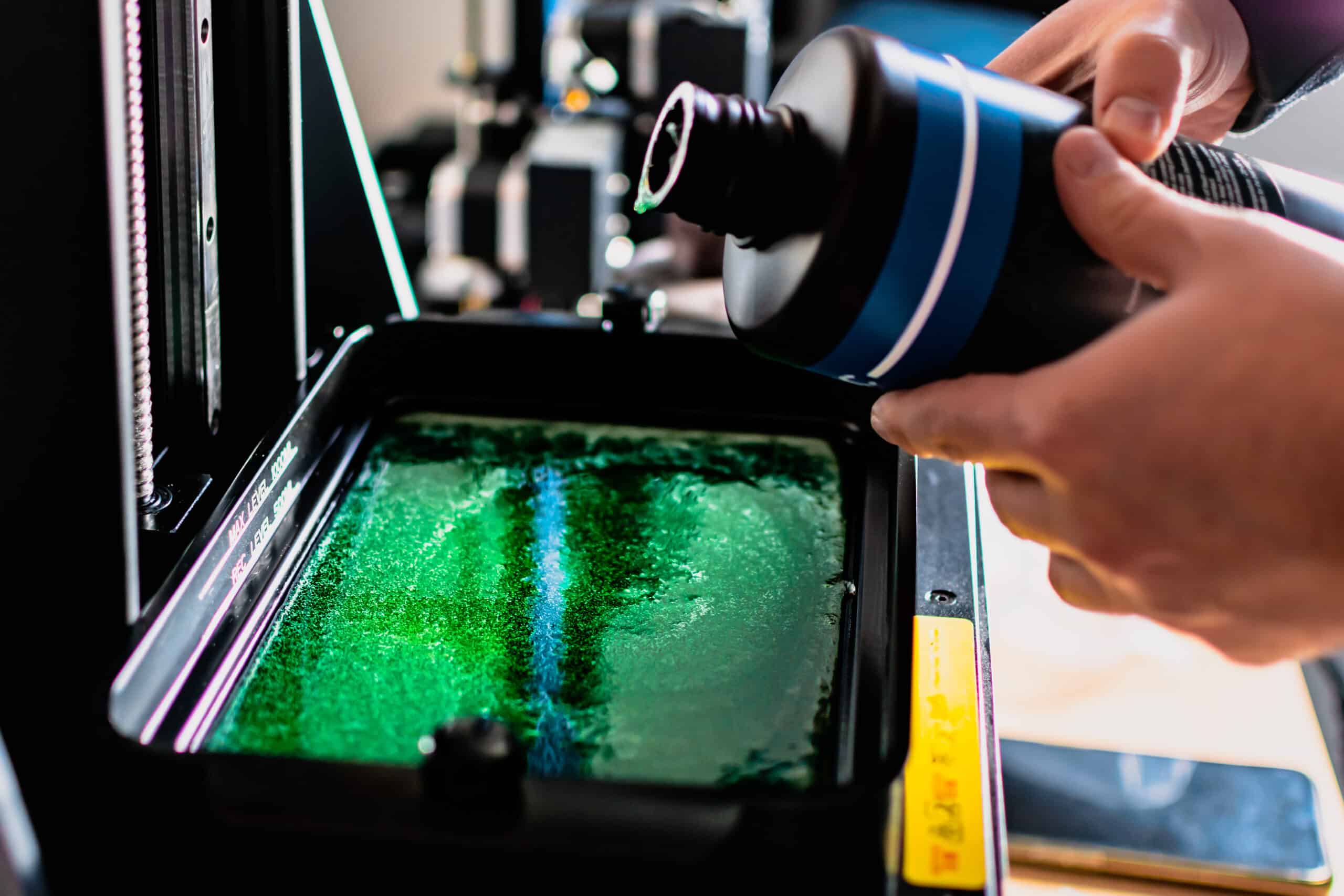 Resin 3D printer with its vat tank open for filling with liquid resin