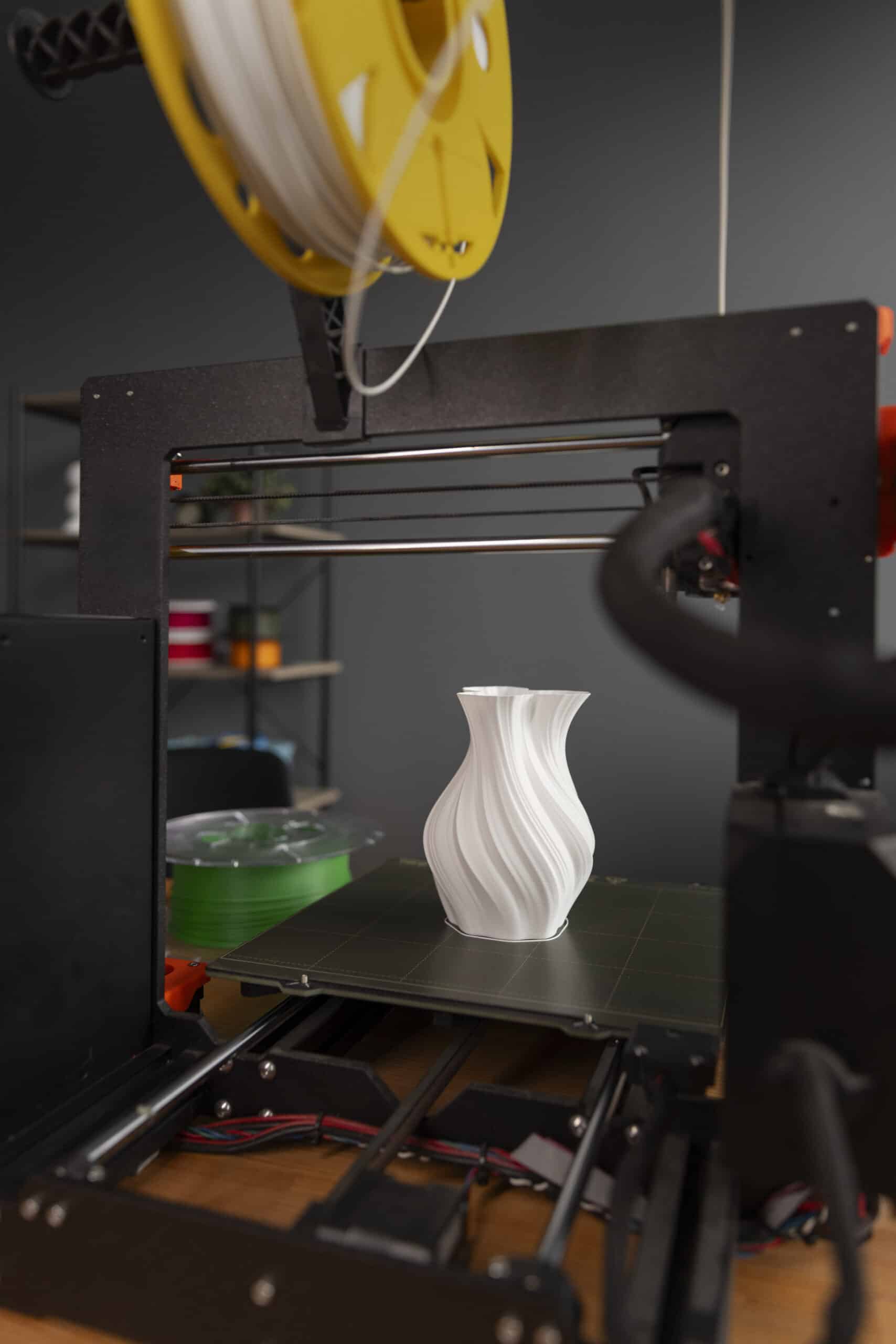 Person setting up a Bambu Lab P2S 3D printer for first use