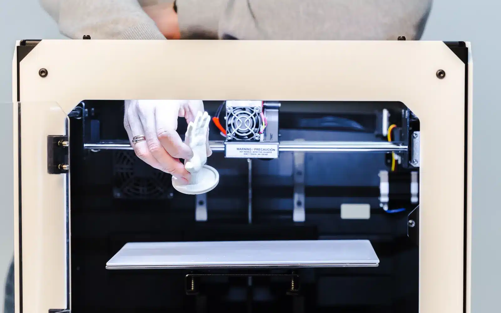 FDM printer laying plastic filament onto the build plate