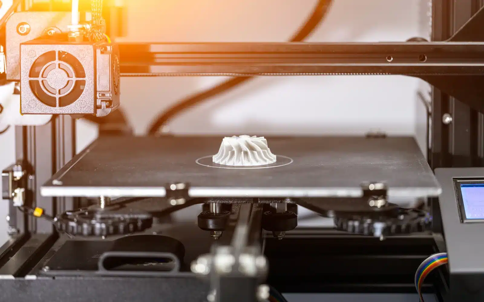 3D printer producing a turbine-shaped plastic part