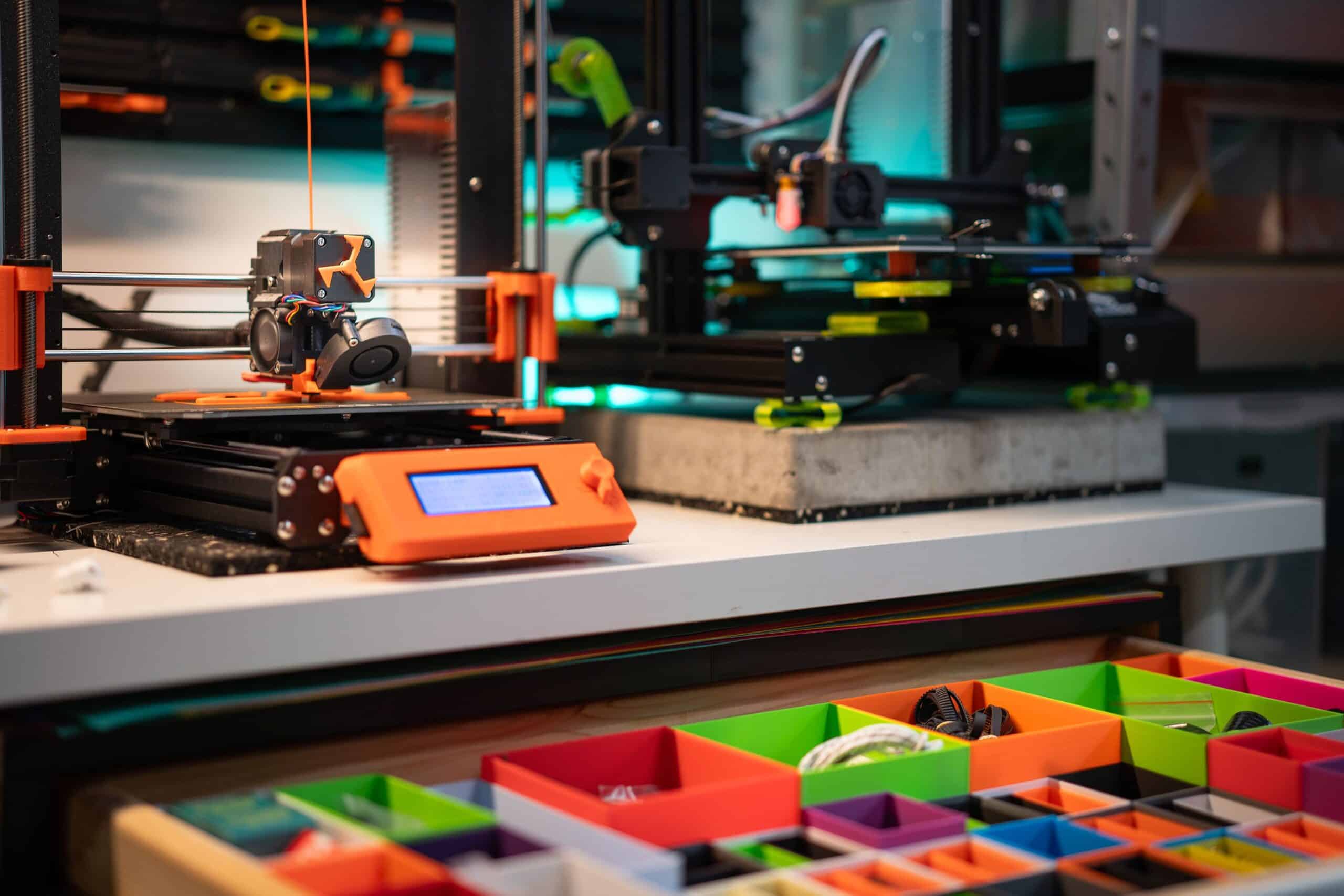 Vibrant 3D printing station showcasing modern equipment and organized storage boxes