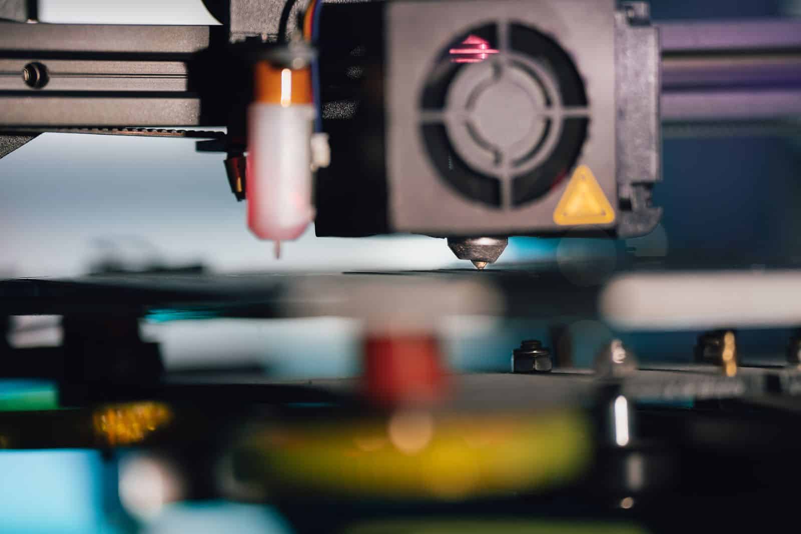 Detailed view of a 3D printer extruder, showcasing modern technology and precision