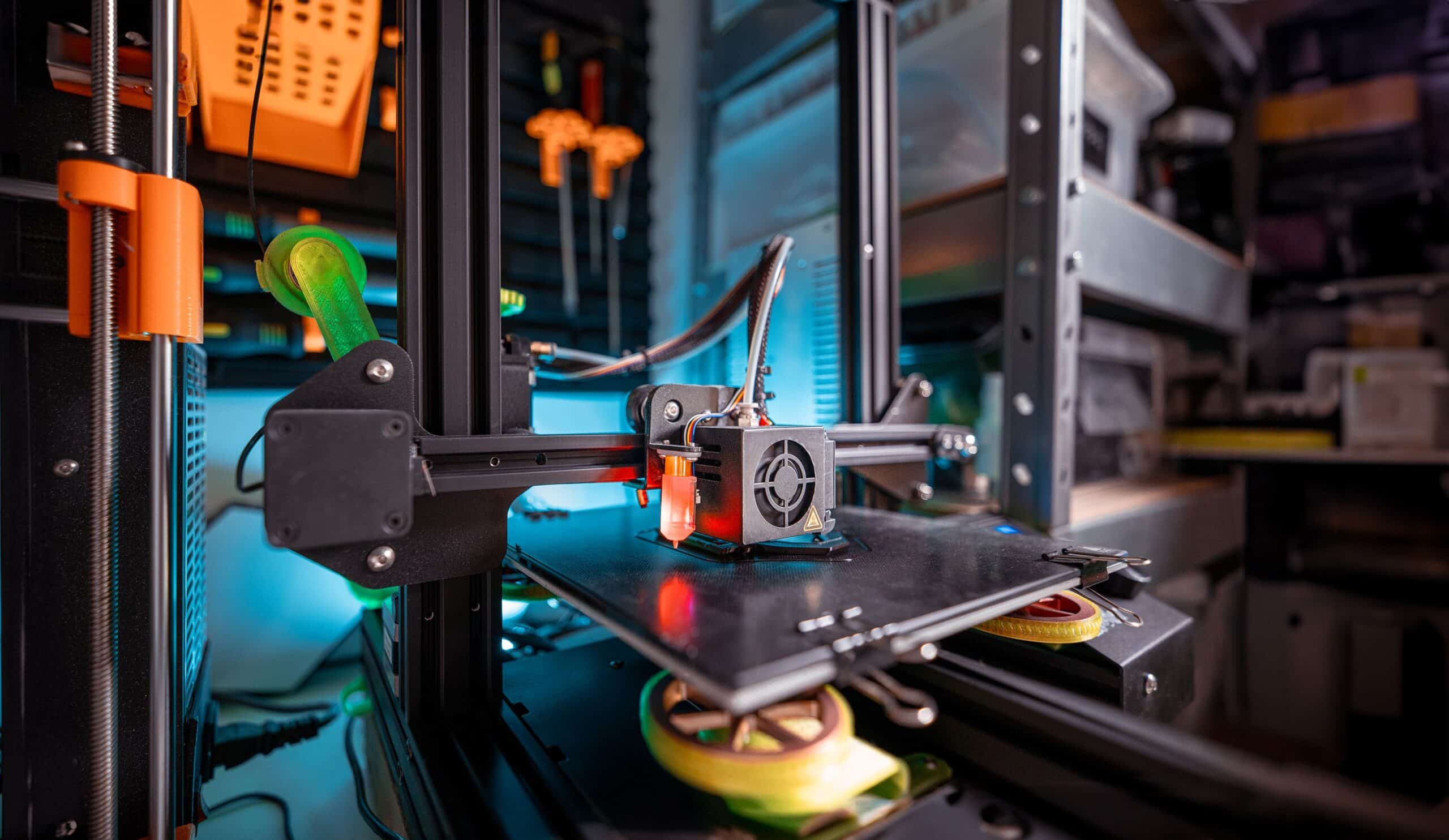 Detailed view of a 3D printer actively working in a workshop environment, showcasing modern technology