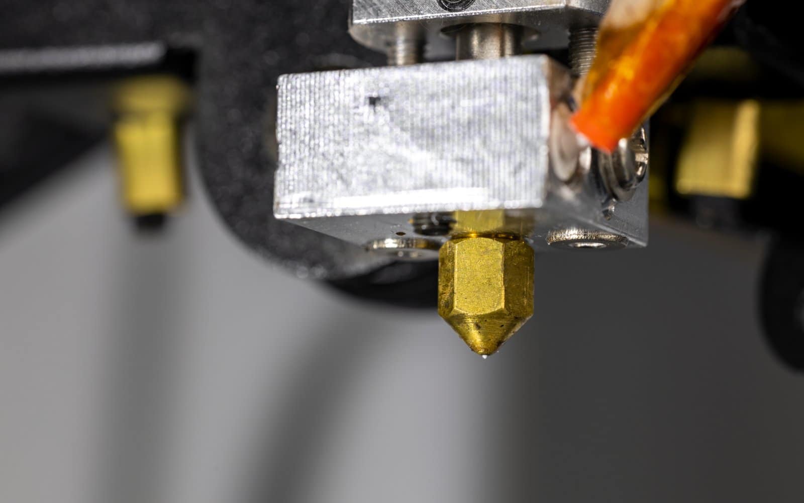 A close-up of a 3D printer's hotend and extruder assembly.