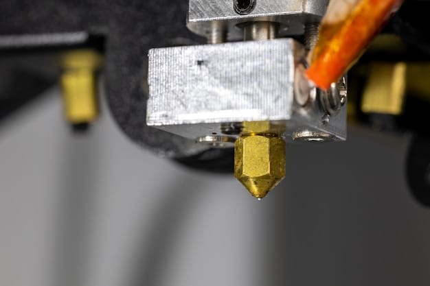 Close-up of a 3D printer hotend and extruder, showing the heater block and nozzle area where the thermistor and heater cartridge sit
